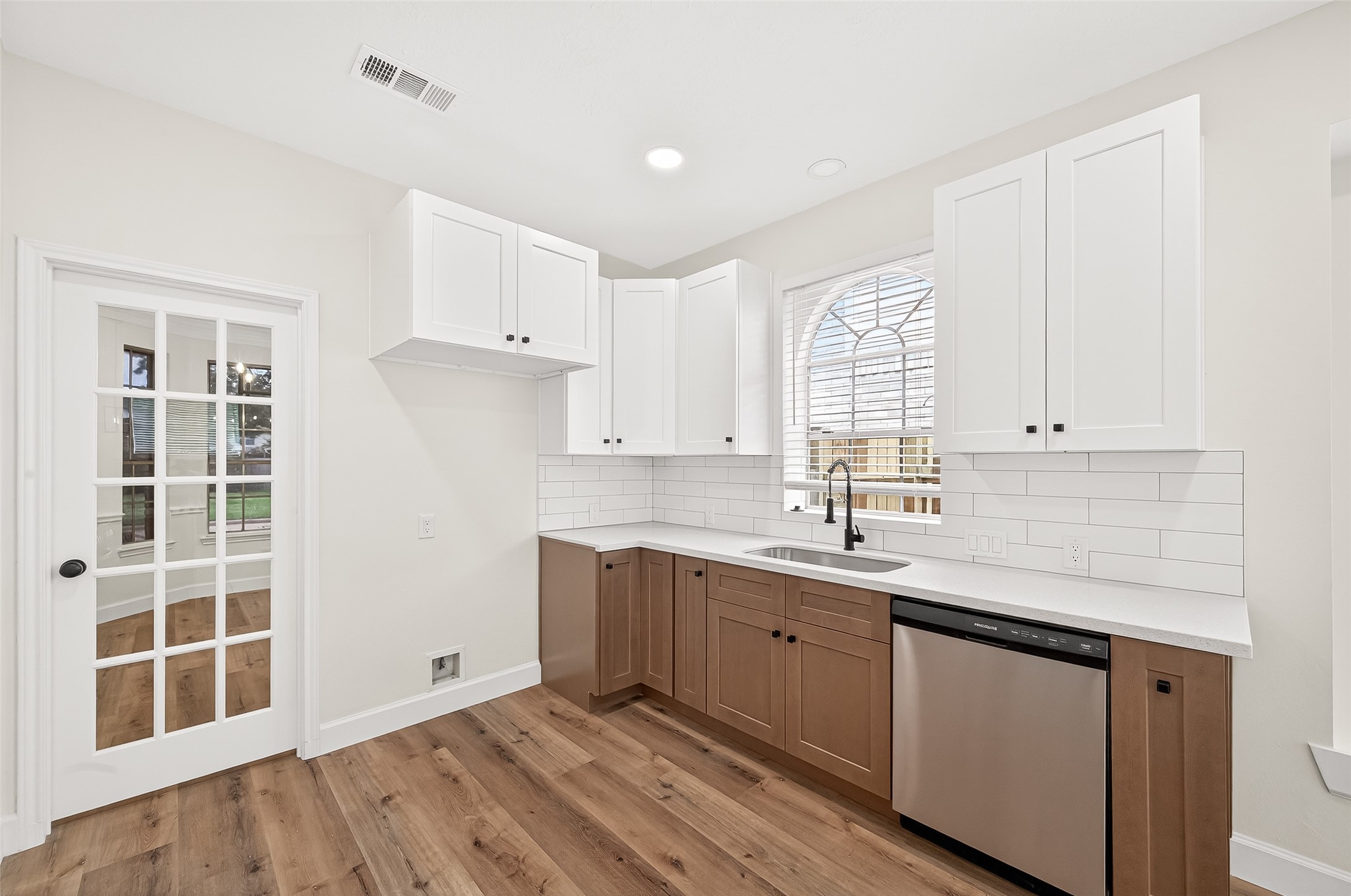 6714 Cleft Stone Drive Houston, TX 77084 - Photo 17 of 49 a kitchen with a sink window and cabinets