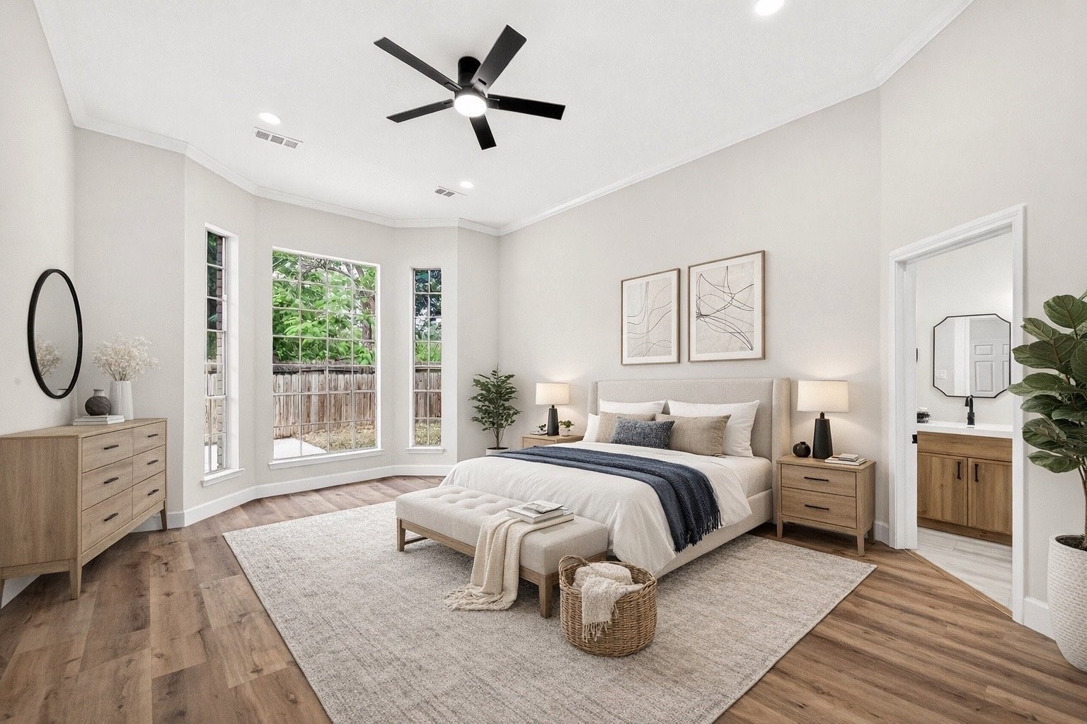 6714 Cleft Stone Drive Houston, TX 77084 - Photo 22 of 49 a spacious bedroom with a large bed and a chandelier