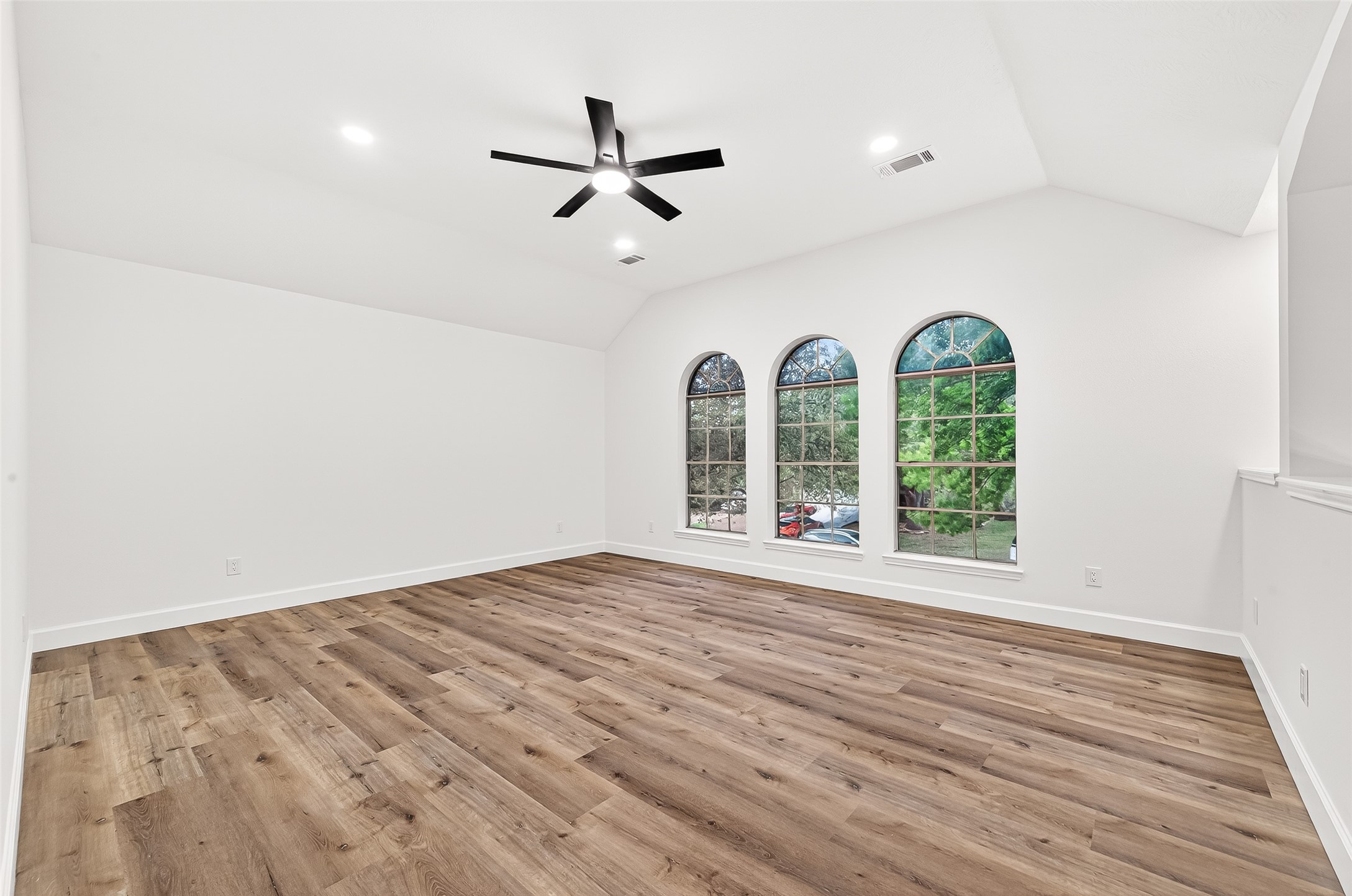 6714 Cleft Stone Drive Houston, TX 77084 - Photo 27 of 49 a view of empty room with wooden floor and fan