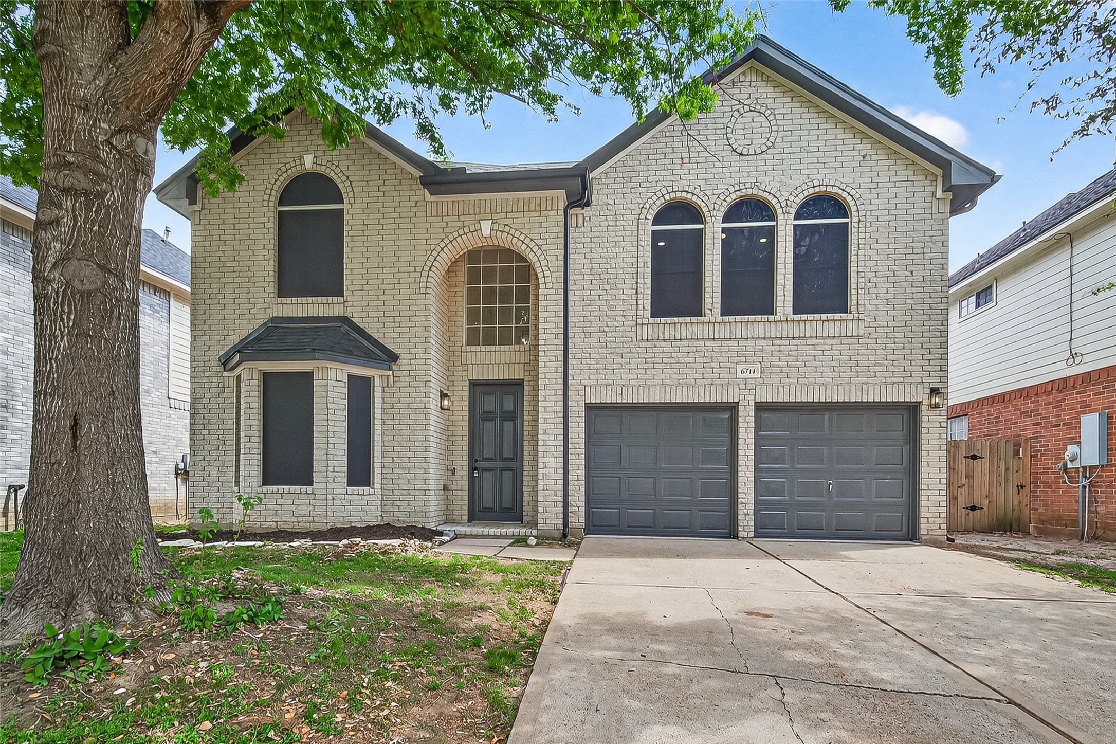 6714 Cleft Stone Drive Houston, TX 77084 - Photo 4 of 49 a front view of a house with a yard and garage