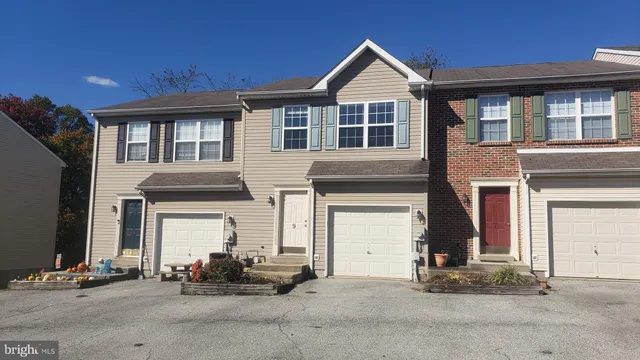 a front view of a house with a outdoor space