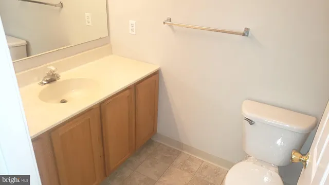 a bathroom with a toilet and a shower curtain