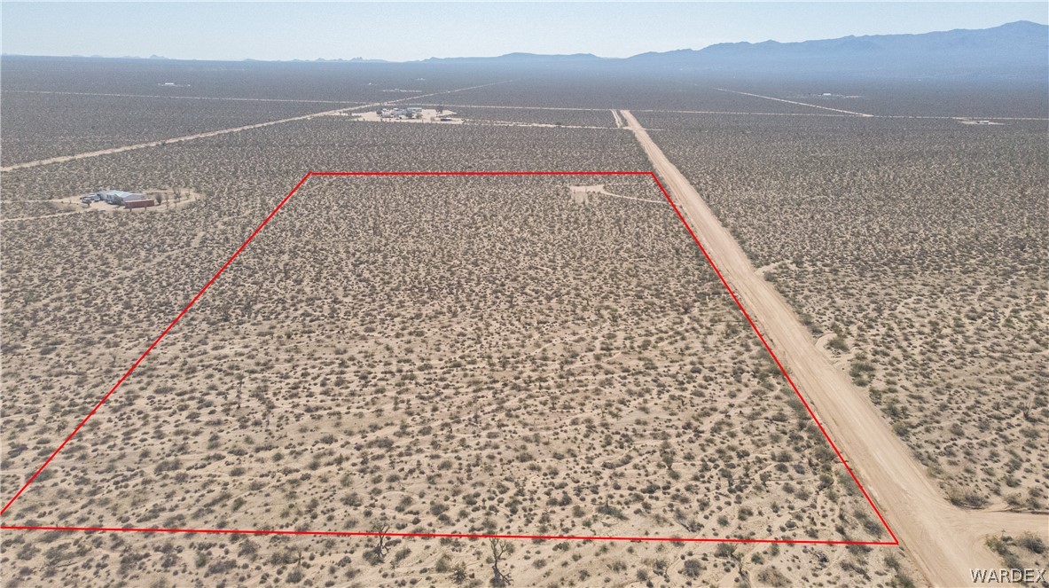 3231 South Cochise Road Yucca, AZ 86438 - Photo 1 of 16 View of rural area featuring property parcel outlined and mountains