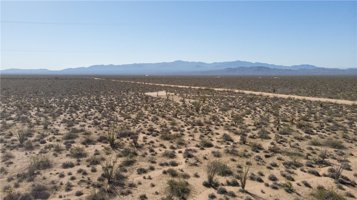3231 South Cochise Road Yucca, AZ 86438 - Photo 12 of 16 View of mountain background with a desert landscape and rural landscape