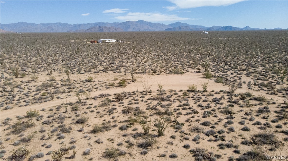 3231 South Cochise Road Yucca, AZ 86438 - Photo 5 of 16 View of mountain backdrop featuring a desert landscape and rural landscape