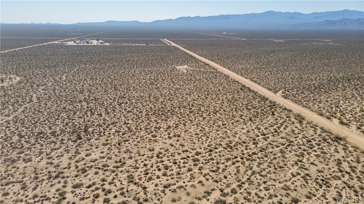 3231 South Cochise Road Yucca, AZ 86438 - Photo 9 of 16 Drone / aerial view of a mountain backdrop