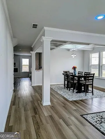 a kitchen with kitchen island granite countertop a sink cabinets and stainless steel appliances