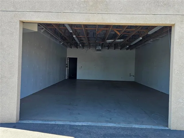 a view of room with window and front door