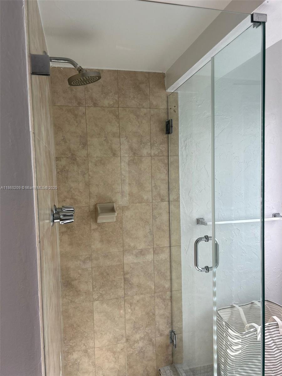 3036 Southwest 27th Avenue, Unit 5 Miami, FL 33133 - Photo 4 of 18 a bathroom with a shower