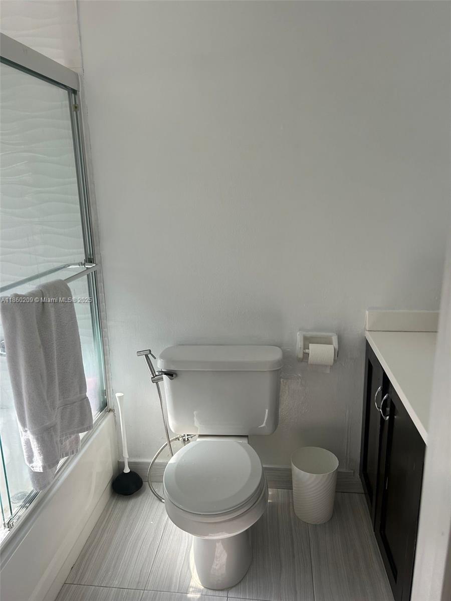 3036 Southwest 27th Avenue, Unit 5 Miami, FL 33133 - Photo 8 of 18 a bathroom with a toilet and a sink