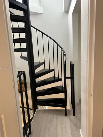 a bedroom with a bed and cabinets