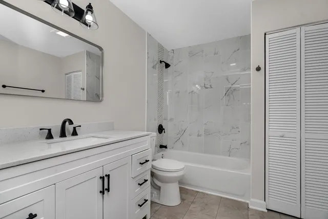 a bathroom with a sink a toilet and a bathtub