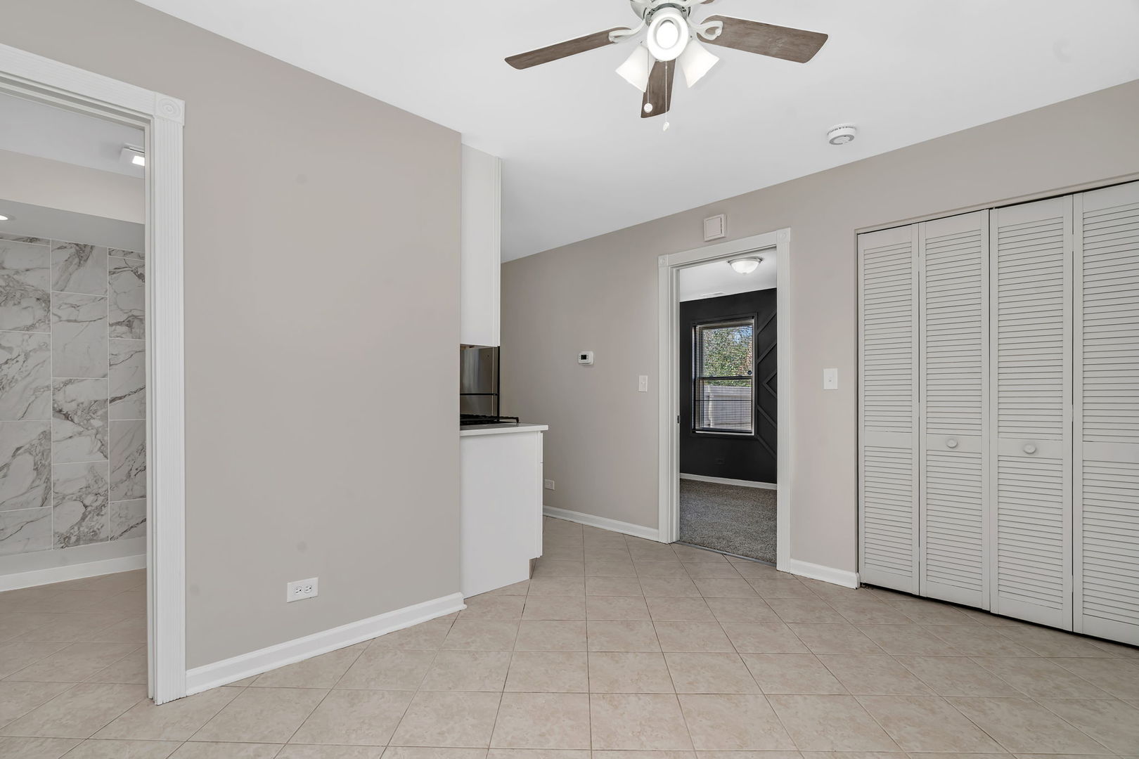 3624 151st Street Midlothian, IL 60445 - Photo 18 of 26 an empty room with fan and entrance