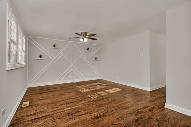 a view of a room with wooden floor