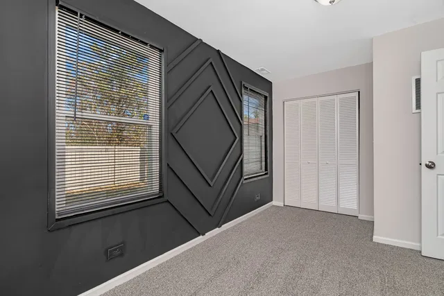 a view of a hallway with a window