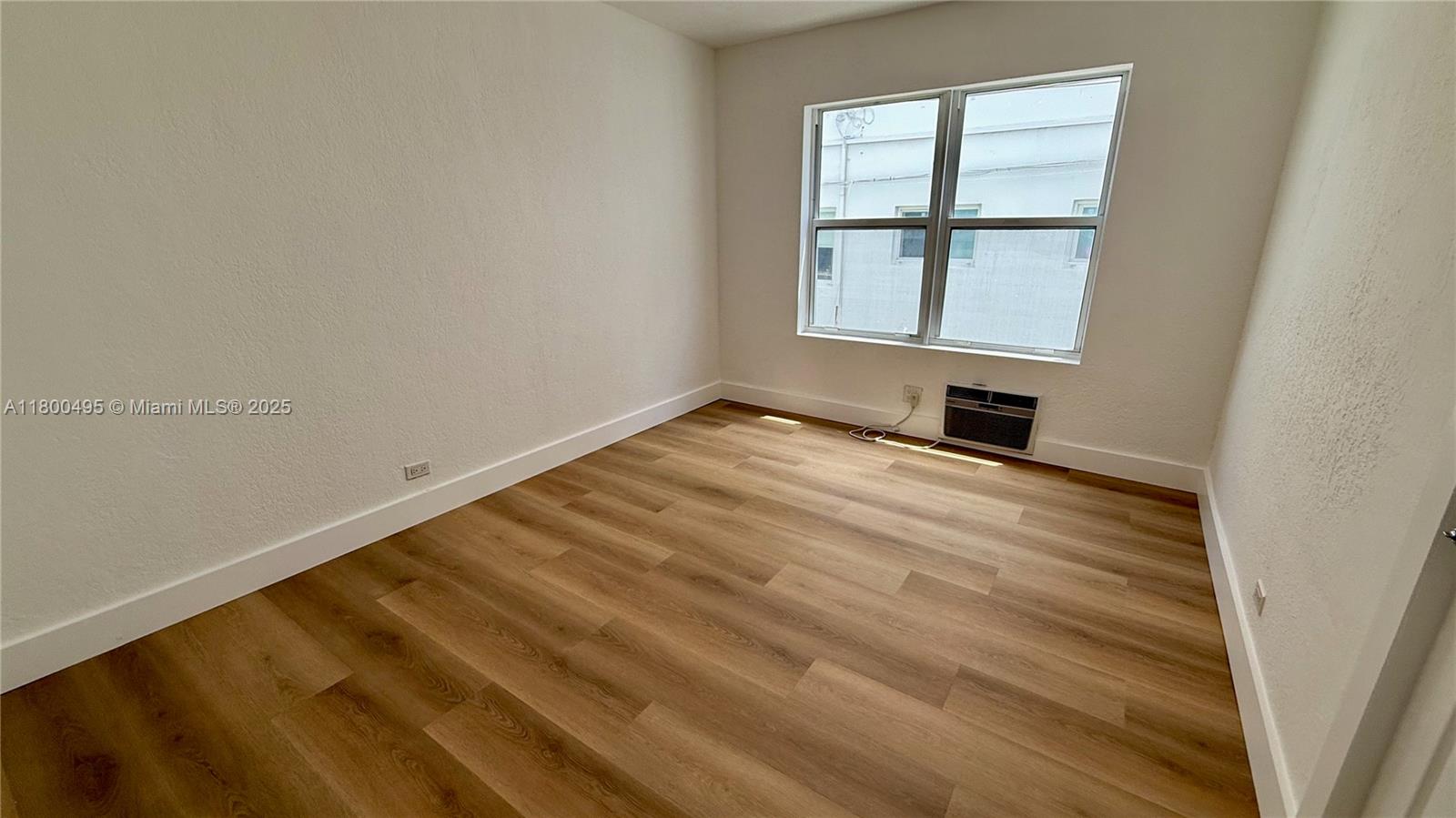 7334 Harding Avenue, Unit 3 Miami Beach, FL 33141 - Photo 11 of 23 an empty room with a window