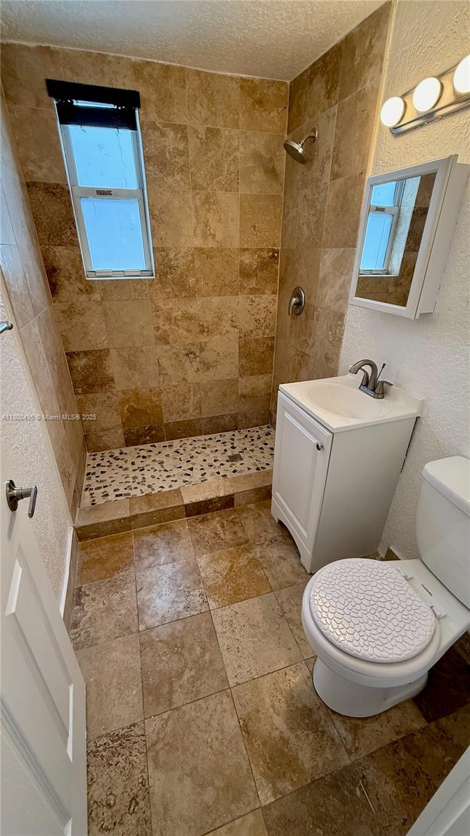 7334 Harding Avenue, Unit 3 Miami Beach, FL 33141 - Photo 20 of 23 a bathroom with a toilet and a shower