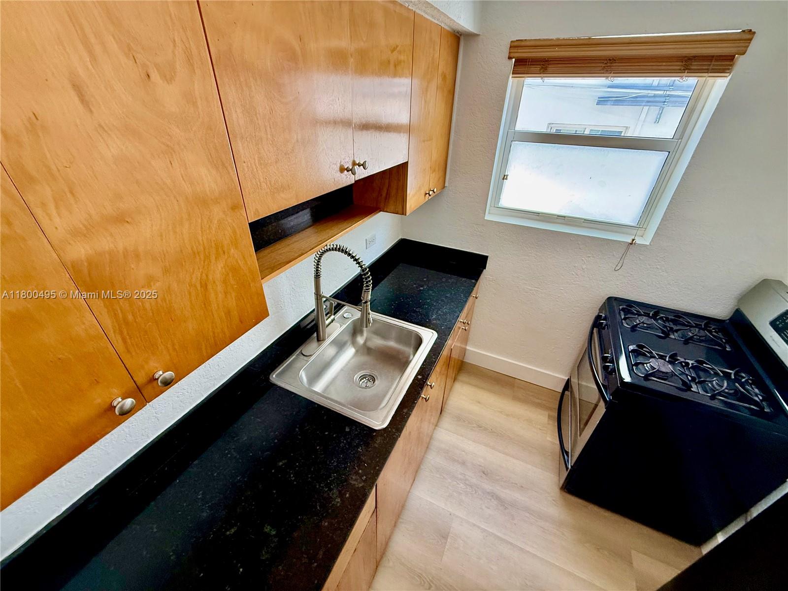 7334 Harding Avenue, Unit 3 Miami Beach, FL 33141 - Photo 3 of 23 a view of workspace with wooden floor