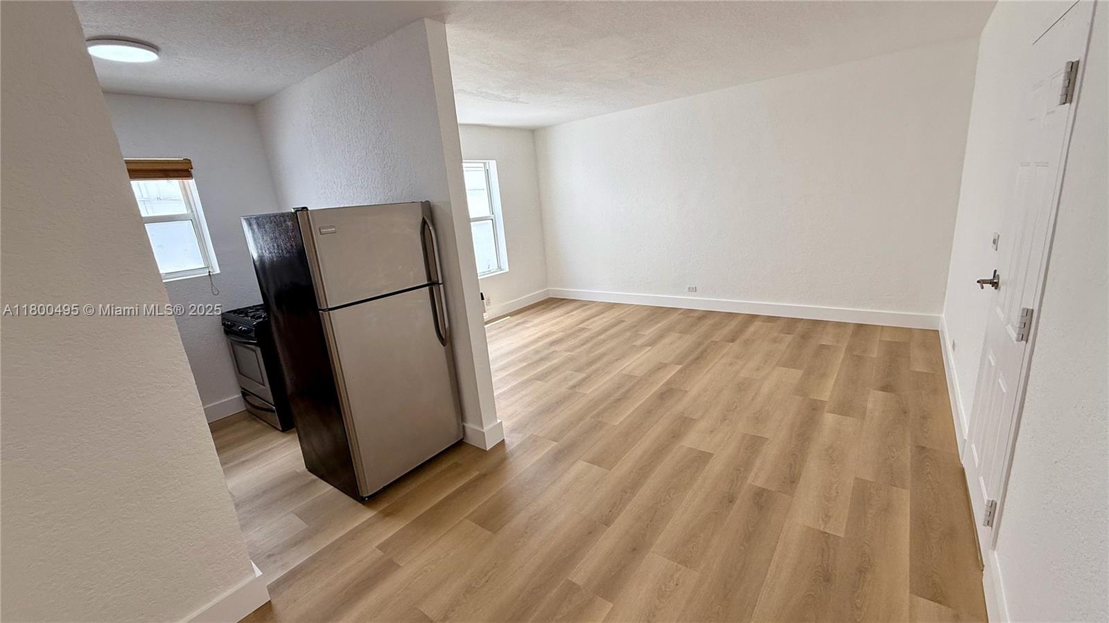 7334 Harding Avenue, Unit 3 Miami Beach, FL 33141 - Photo 8 of 23 a view of a refrigerator in kitchen and a window