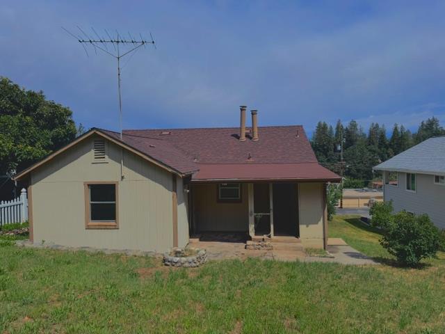 240 Pleasant Street Colfax, CA 95713 - Photo 22 of 26 a front view of a house with a yard and garage