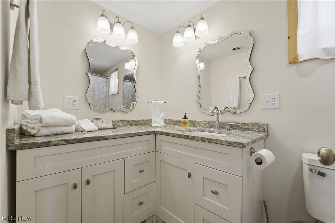 5919 Lake Road West, Unit 32 Ashtabula, OH 44004 - Photo 9 of 23 Bathroom with double vanity and toilet