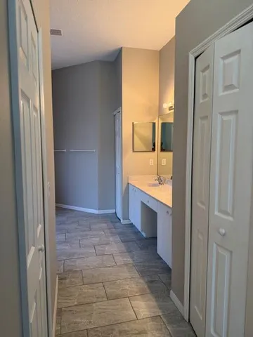a bathroom with a bathtub and a sink