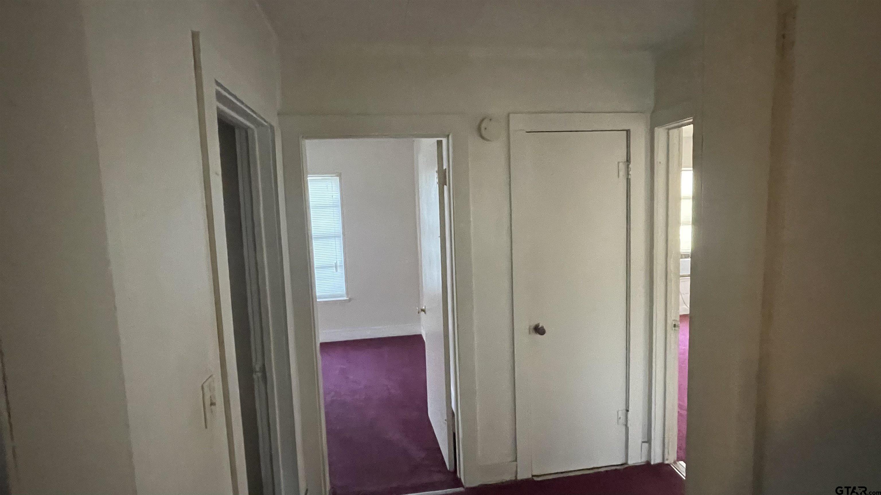 1402 Academy Tyler, TX 75701 - Photo 12 of 14 a view of a hallway with wooden floor