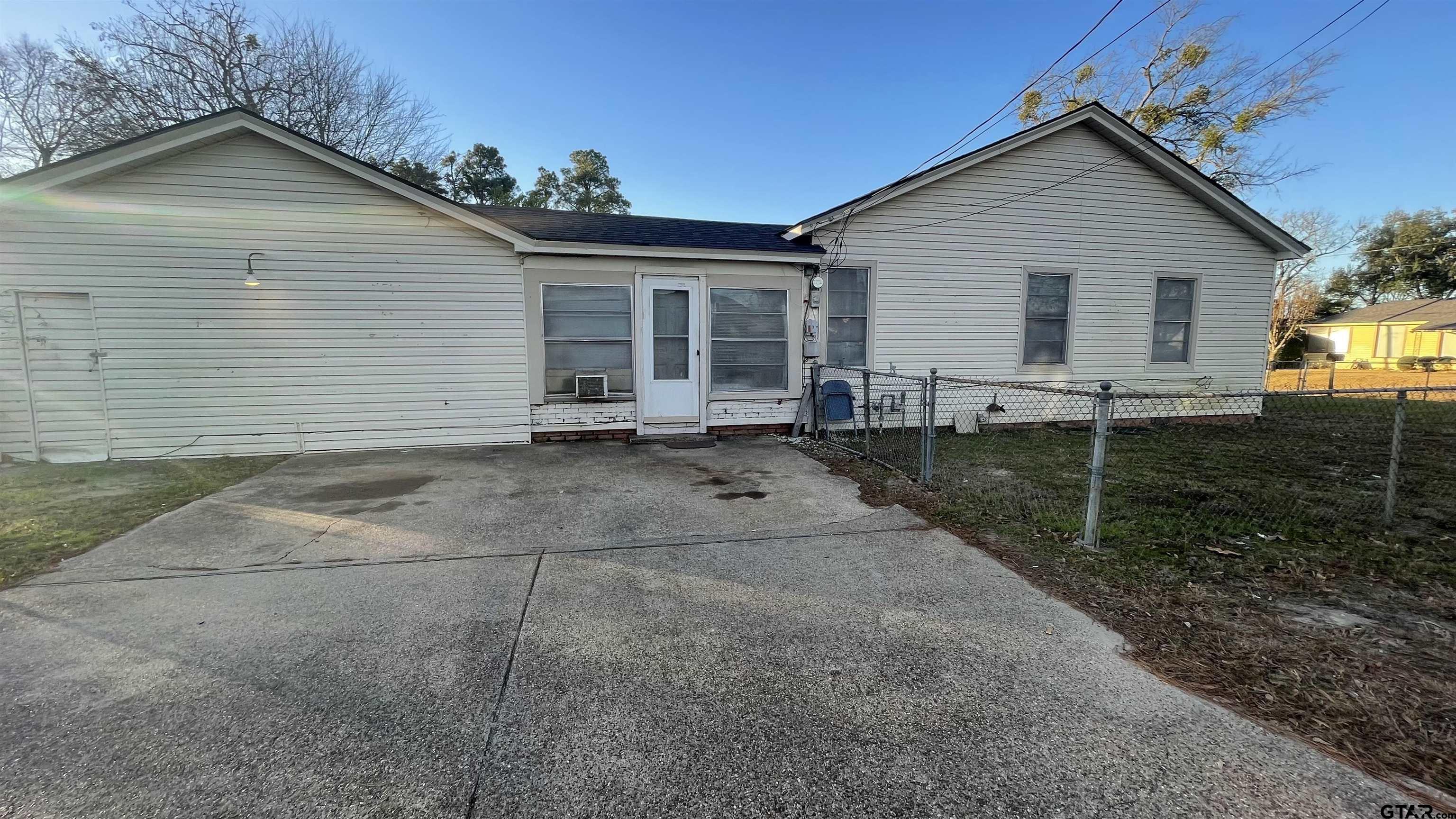 1402 Academy Tyler, TX 75701 - Photo 13 of 14 a view of a house with backyard