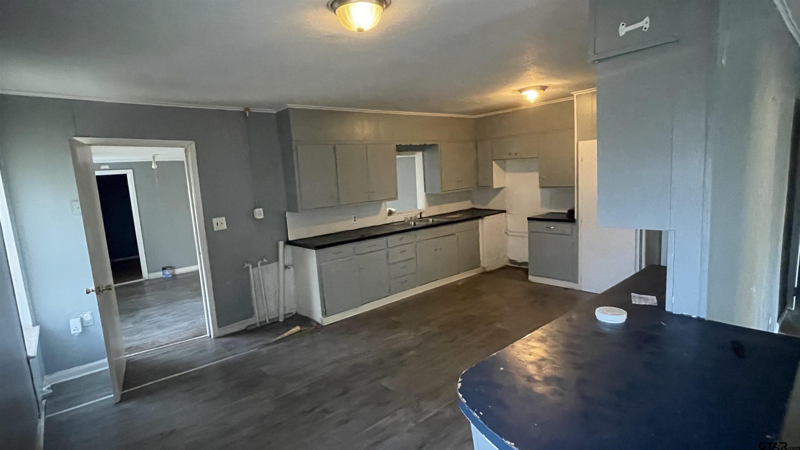 1402 Academy Tyler, TX 75701 - Photo 6 of 14 a view of a kitchen with a sink