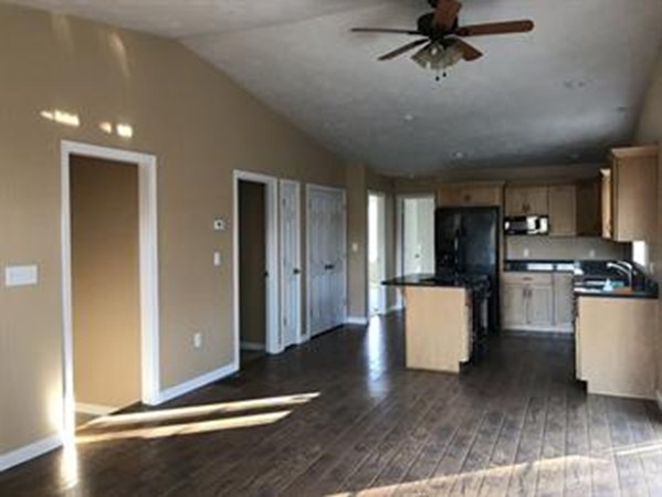 212 Barre Paxton Road, Unit 1 Rutland, MA 01543 - Photo 6 of 19 a view of kitchen with furniture and wooden floor