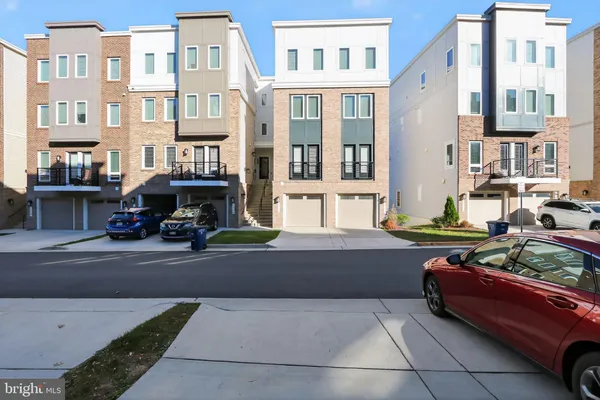 a view of building with car parked