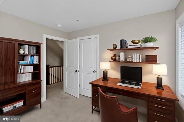 a view of a workspace with furniture