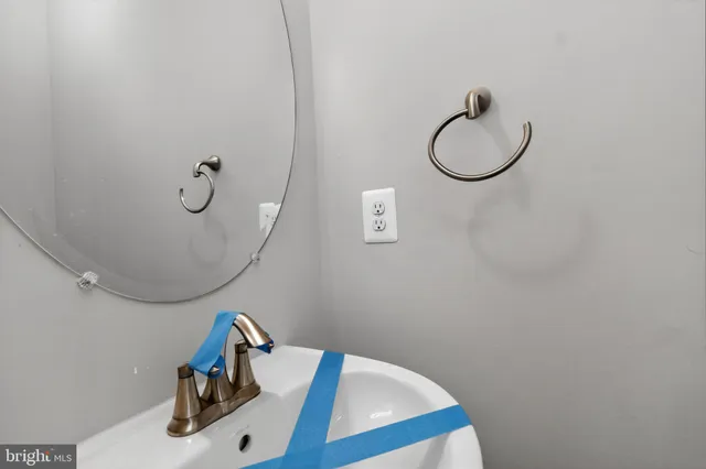 a bathroom with a sink and mirror