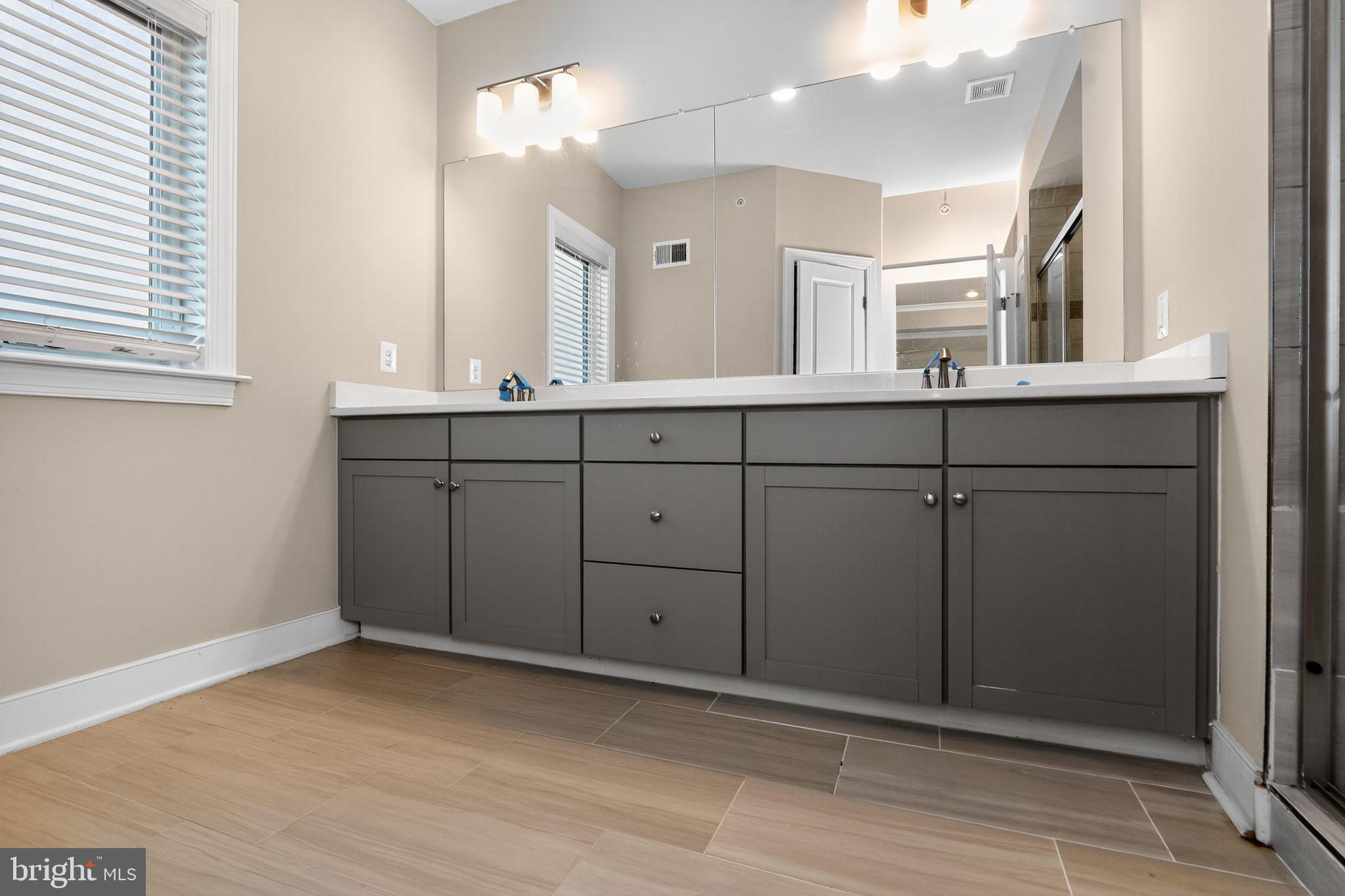 1322 Rail Woodbridge, VA 22191 - Photo 23 of 30 a bathroom with a sink and a mirror