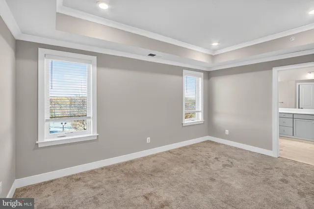 a view of empty room with windows