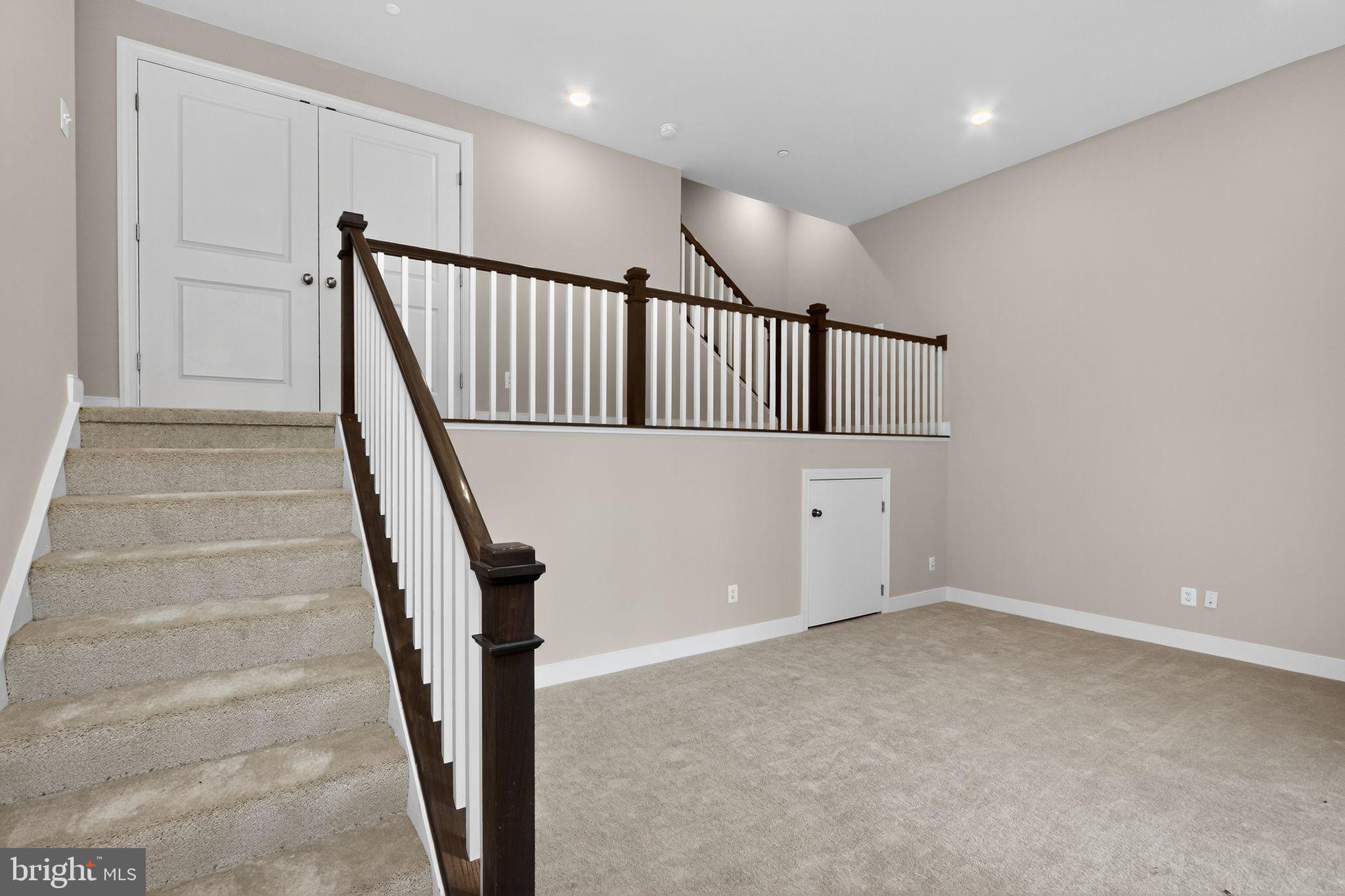 1322 Rail Woodbridge, VA 22191 - Photo 27 of 30 a view of staircase with white walls and railing