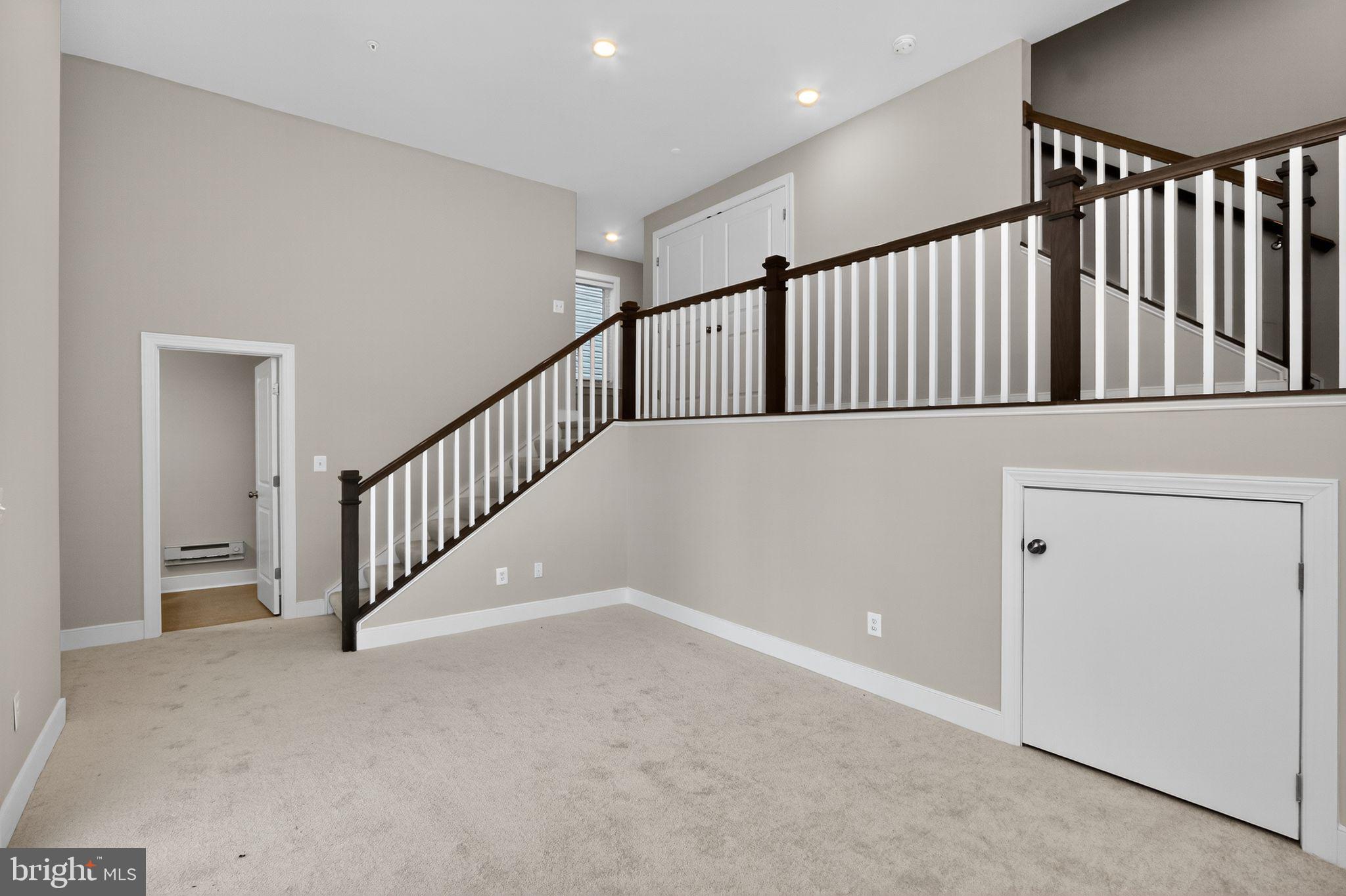 1322 Rail Woodbridge, VA 22191 - Photo 28 of 30 a view of staircase with lots of frames on wall