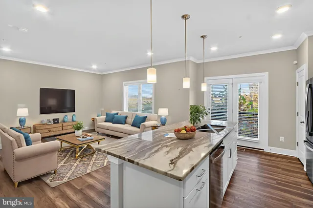 a living room with fireplace furniture and a flat screen tv