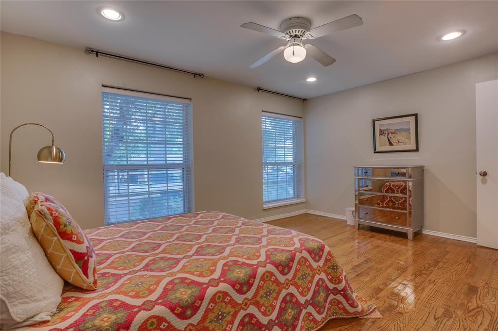7777 Royal Lane Dallas, TX 75230 - Photo 19 of 30 a bedroom with a bed and a dresser