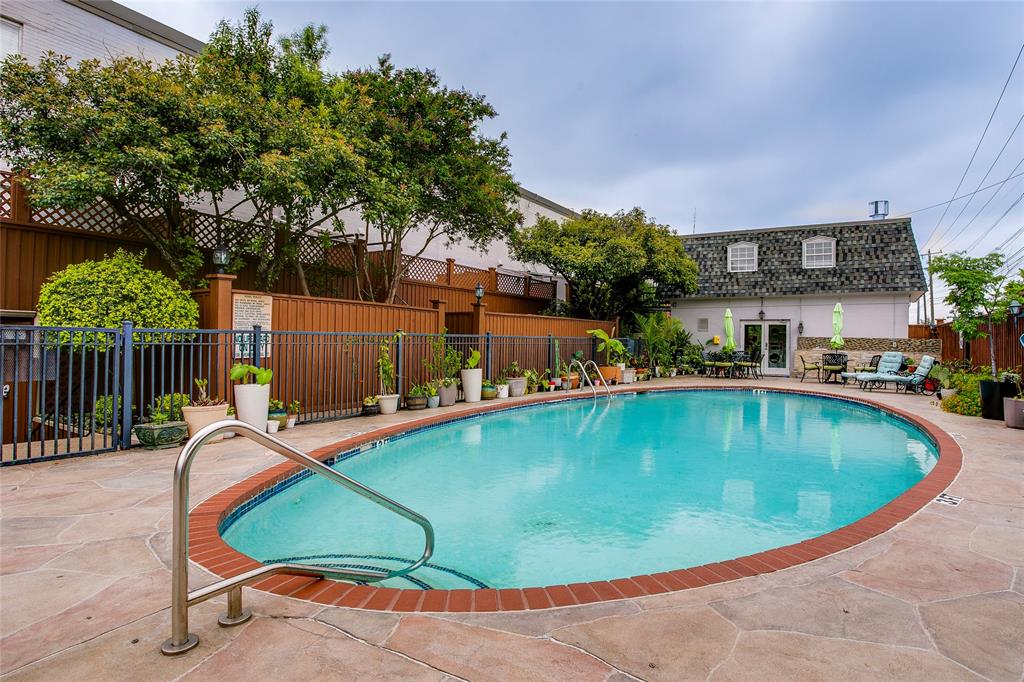 7777 Royal Lane Dallas, TX 75230 - Photo 25 of 30 a view of a swimming pool with a patio