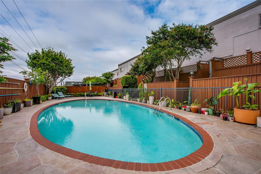 7777 Royal Lane Dallas, TX 75230 - Photo 26 of 30 a view of a swimming pool with an outdoor seating