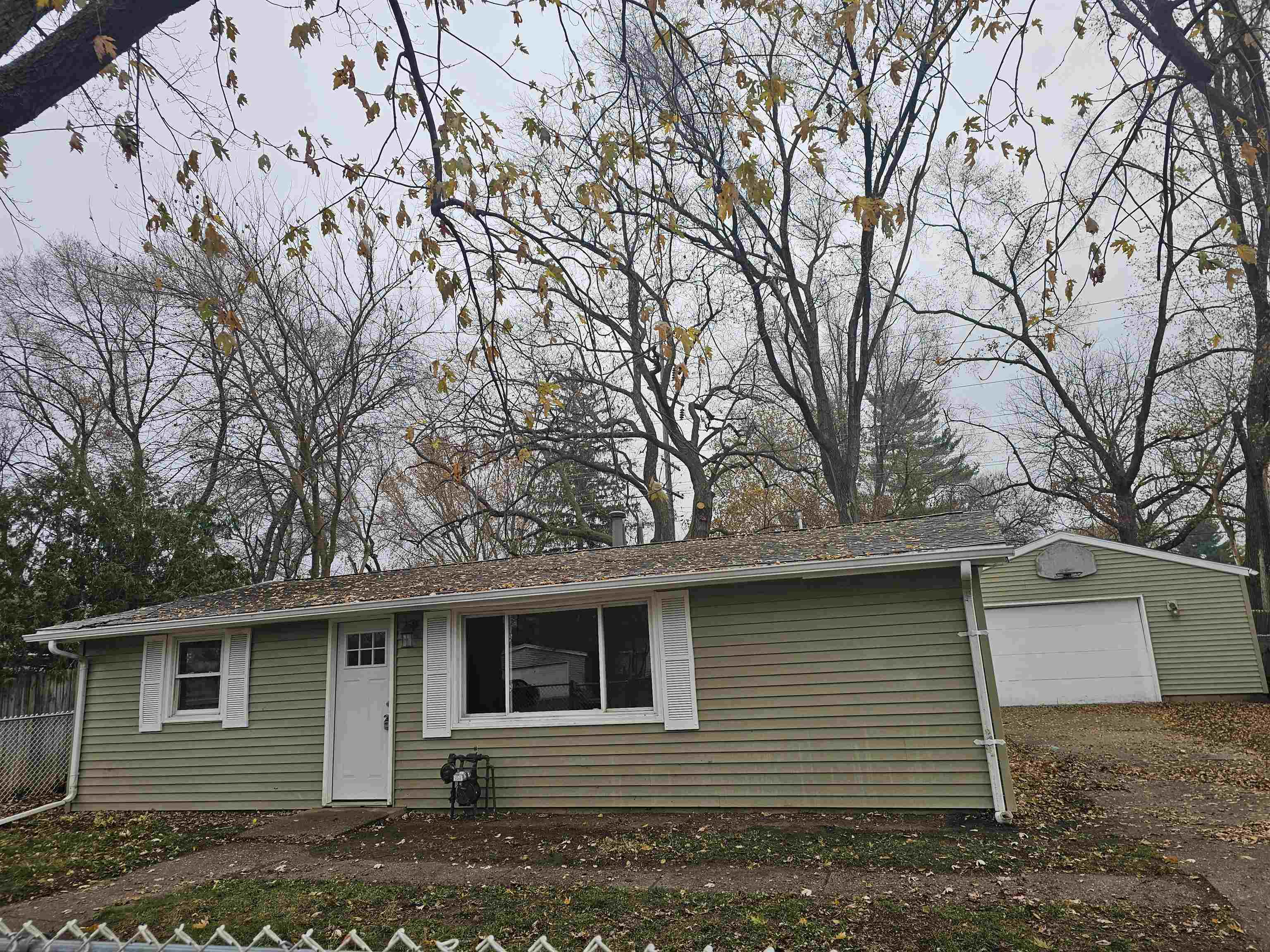 7913 Mildred Road Machesney Park, IL 61115 - Photo 1 of 20 a front view of a house with garden