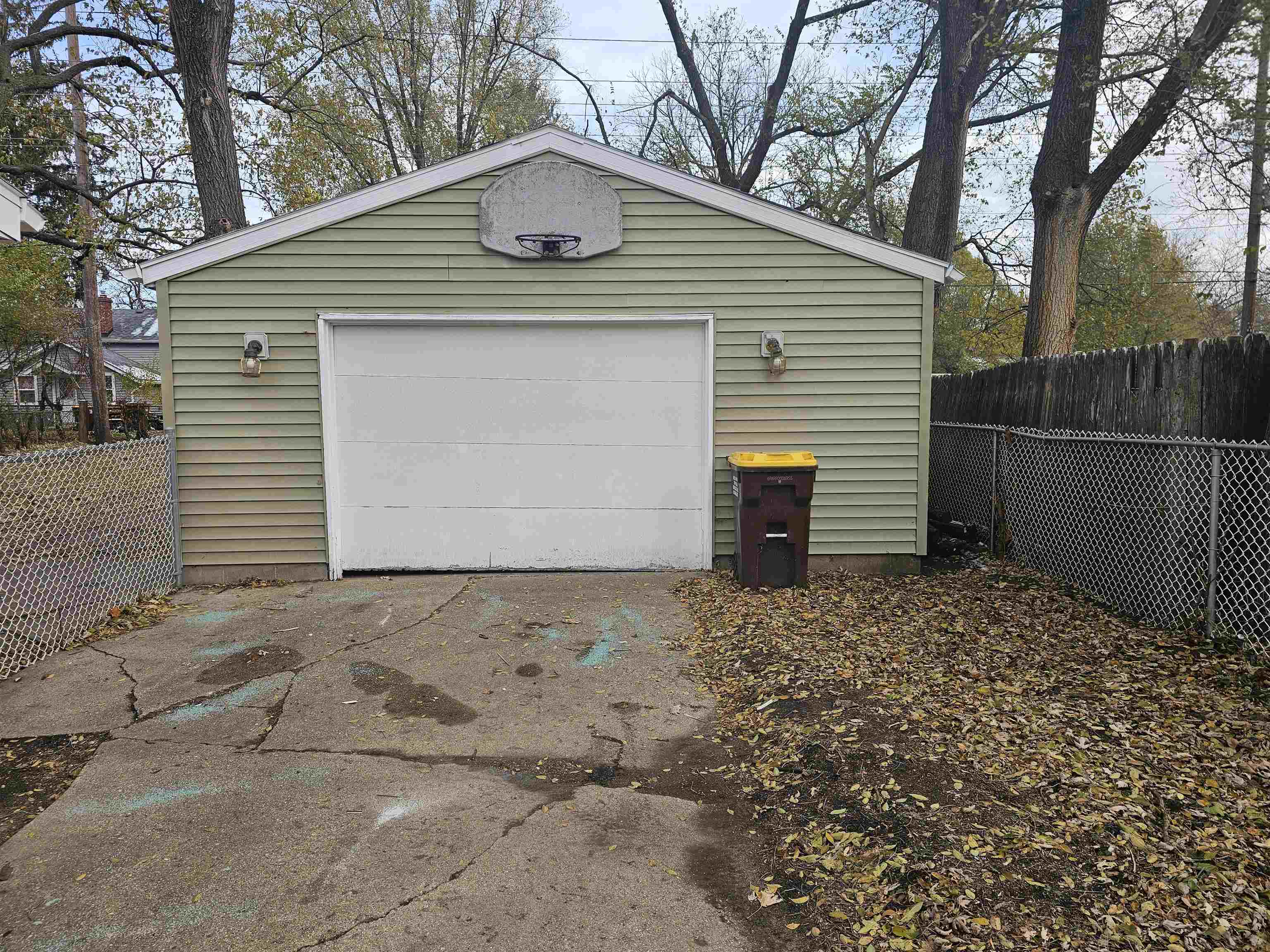 7913 Mildred Road Machesney Park, IL 61115 - Photo 18 of 20 a front view of a house with a yard and garage