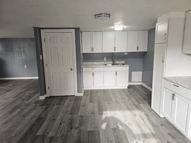 a kitchen with a sink and cabinets