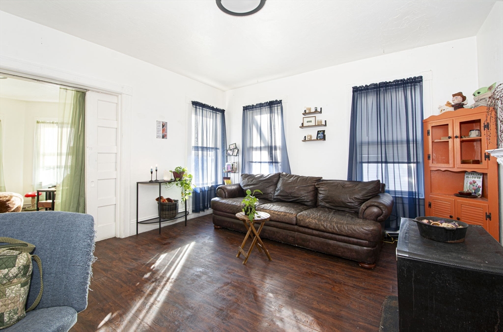 109 Merrifield Street Worcester, MA 01605 - Photo 16 of 21 a living room with furniture window and wooden floor