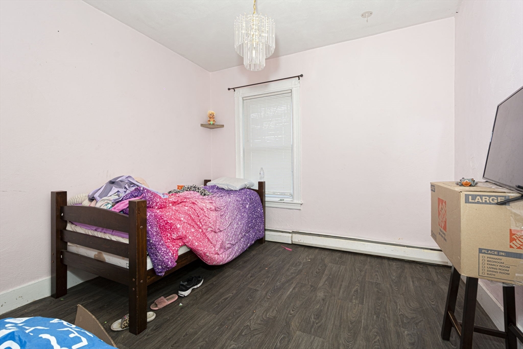 109 Merrifield Street Worcester, MA 01605 - Photo 18 of 21 a living room with furniture and a flat screen tv