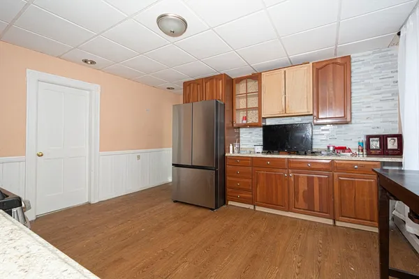 a kitchen with stainless steel appliances granite countertop a refrigerator sink and cabinets