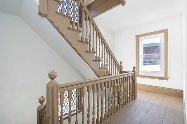 a view of entryway with wooden floor