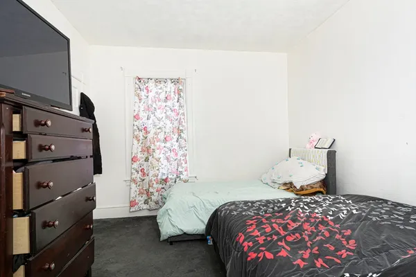 a bedroom with a bed and a cabinets
