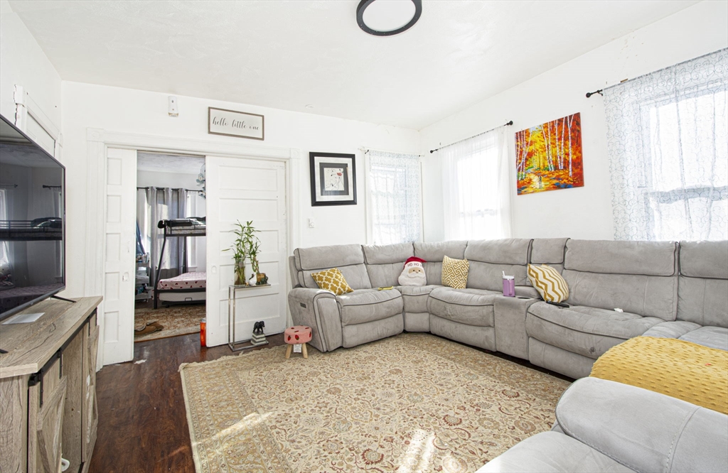 109 Merrifield Street Worcester, MA 01605 - Photo 9 of 21 a living room with furniture and a flat screen tv